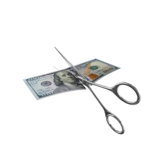 scissors cutting $100 bill, to show cutting costs for college planning.
